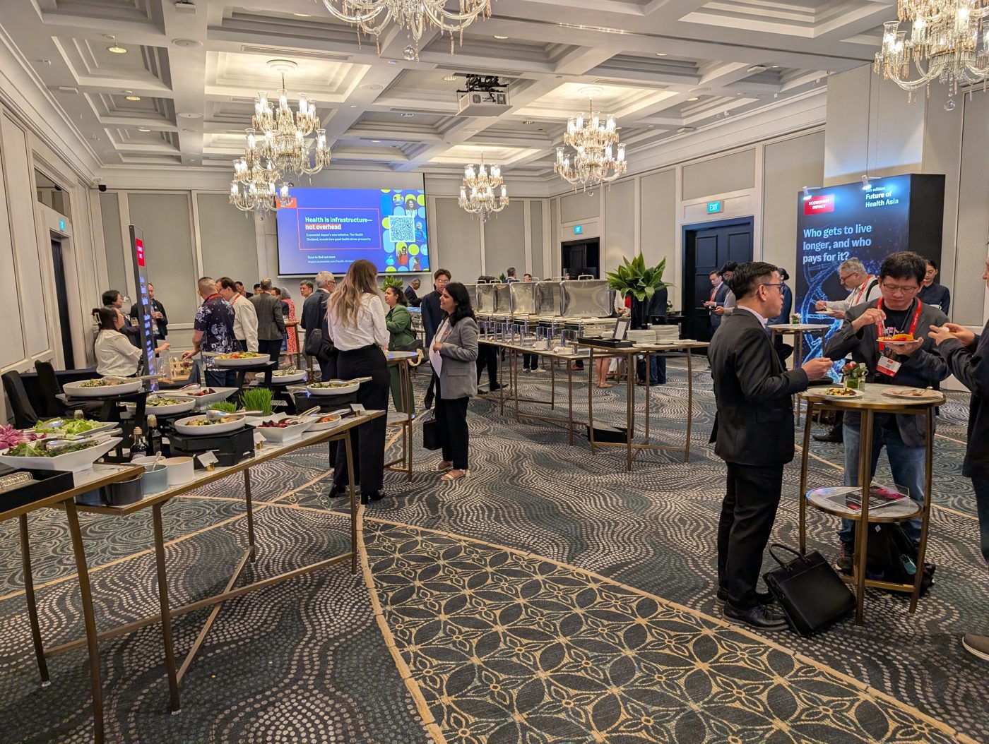 Networking reception beneath chandeliers at Future of Health Asia 2025